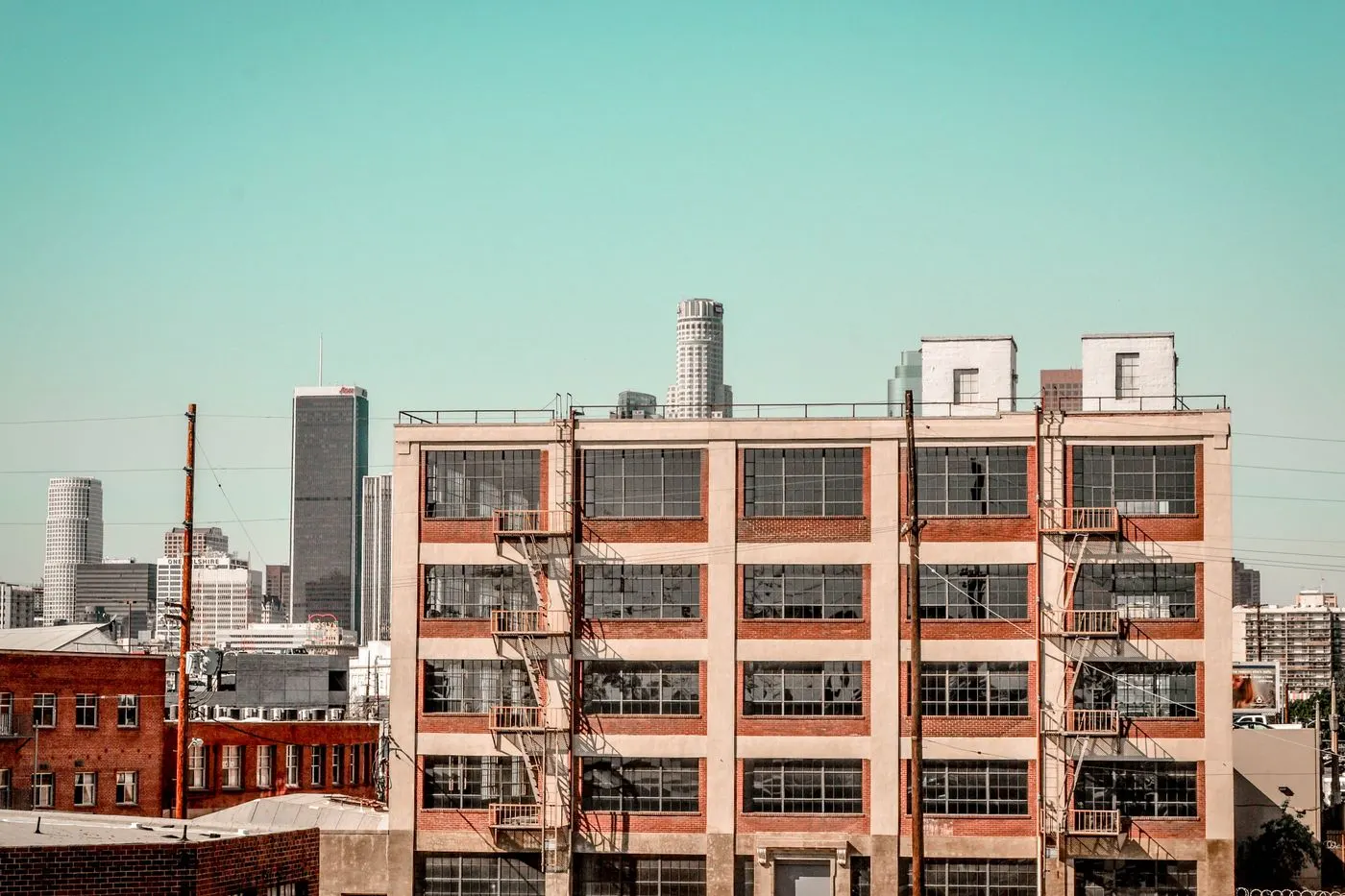 Los Angeles mid-rise building and skyline — EBEWE exemption screening context