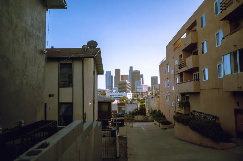 Los Angeles residential street and skyline — context for existing-building EBEWE compliance